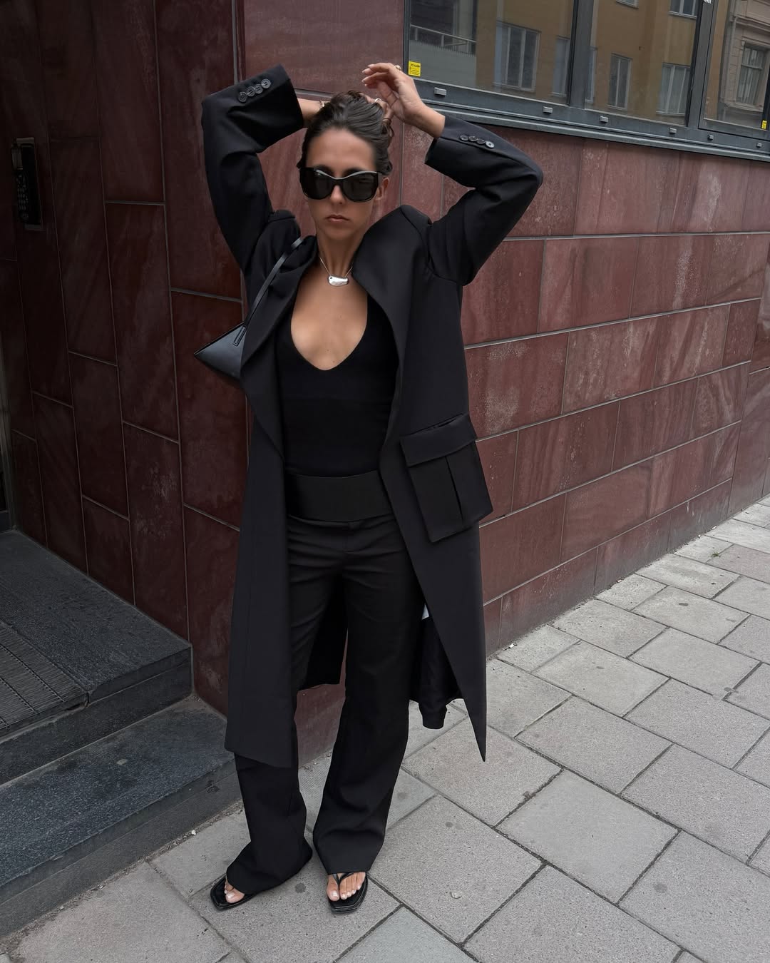 @hannamw wearing black flare trousers