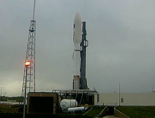 An Atlas 5 rocket holding a U.S. Air Force X-37B space plane in its nose cone sits on the launch pad in Floriday on Friday, March 4, 2011. Bad weather delayed the launch, with another attempt coming March 5.