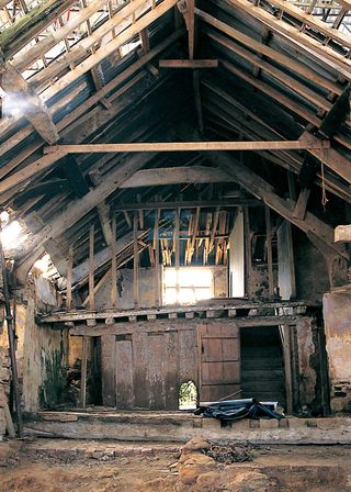 Timber frame building undergoing repair