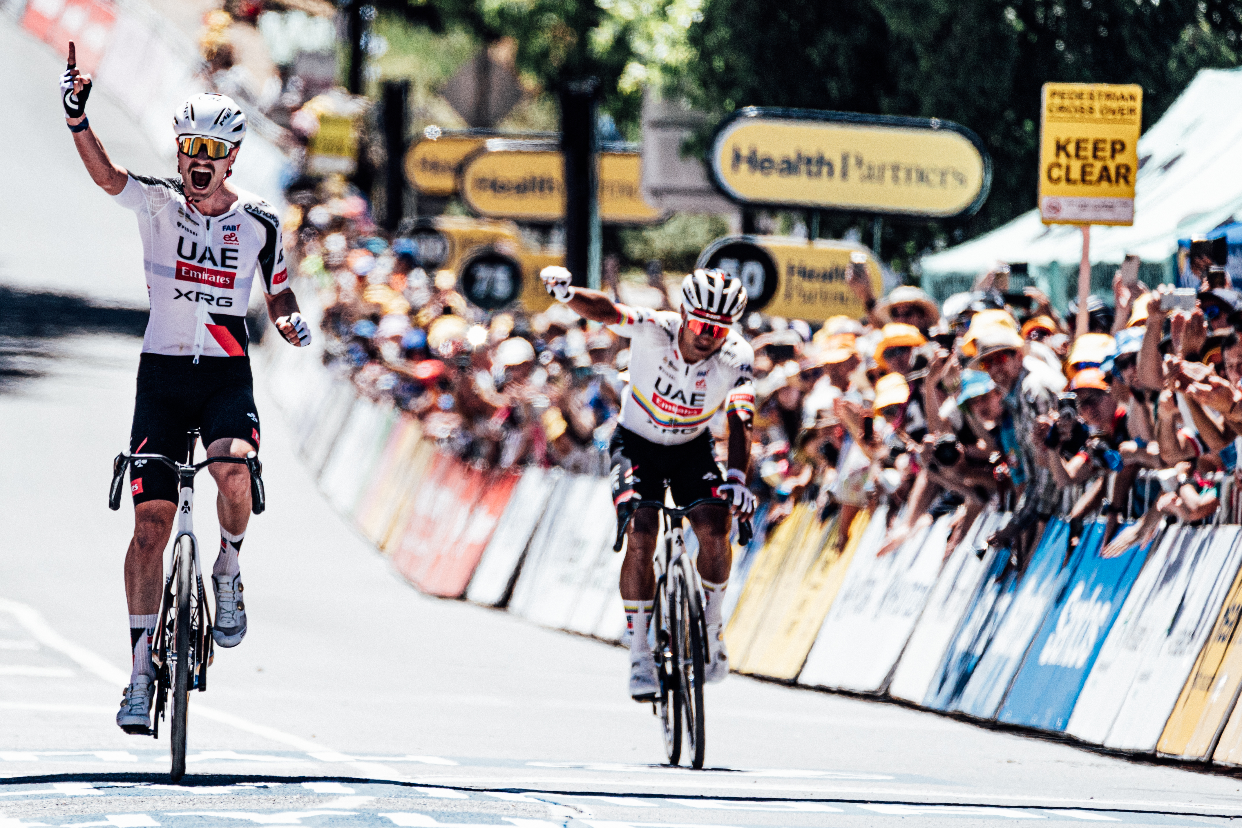 Jay Vine and Jhonathan Narv&aacute;ez celebrate on stage two of the Tour Down Under 2026