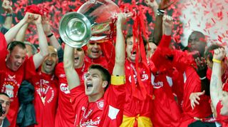 Liverpool's captain Steven Gerrard holds the trophy in front of his team mates after winning the Champions League final soccer match against AC Milan at the Ataturk Olympic stadium in Istanbul May 25, 2005. Liverpool made European soccer history by coming from 3-0 down to beat favourites AC Milan 3-2 on penalties in an astonishing Champions League final that had finished 3-3 after extra time (Photo by liewig christian/Corbis via Getty Images)