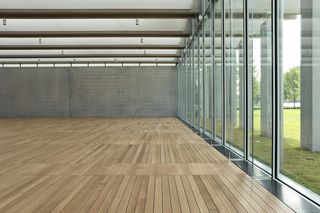 Glass wall with wooden flooring