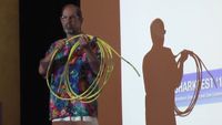 Rich Seifert holding up a yellow ethernet cable