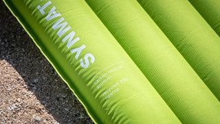 A close-up of a green Exped Ultra 3R sleeping mat.