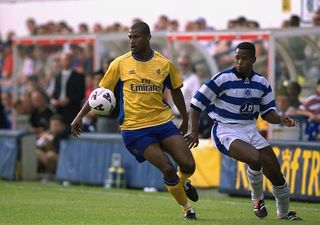 Winston Bogarde of Chelsea shields the ball away from Sammy Koejoe of Queens Park Rangers during the pre-season friendly match played at Loftus Road, in London. Queens Park Rangers won the match 3-1