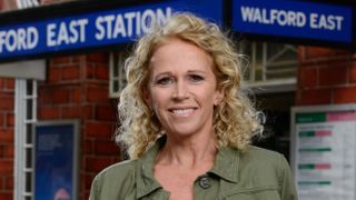 EastEnders icon Lisa Fowler in front of Walford East Station