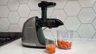 The Amzchef Slow Juicer ZM1501 having just been used to juice carrots