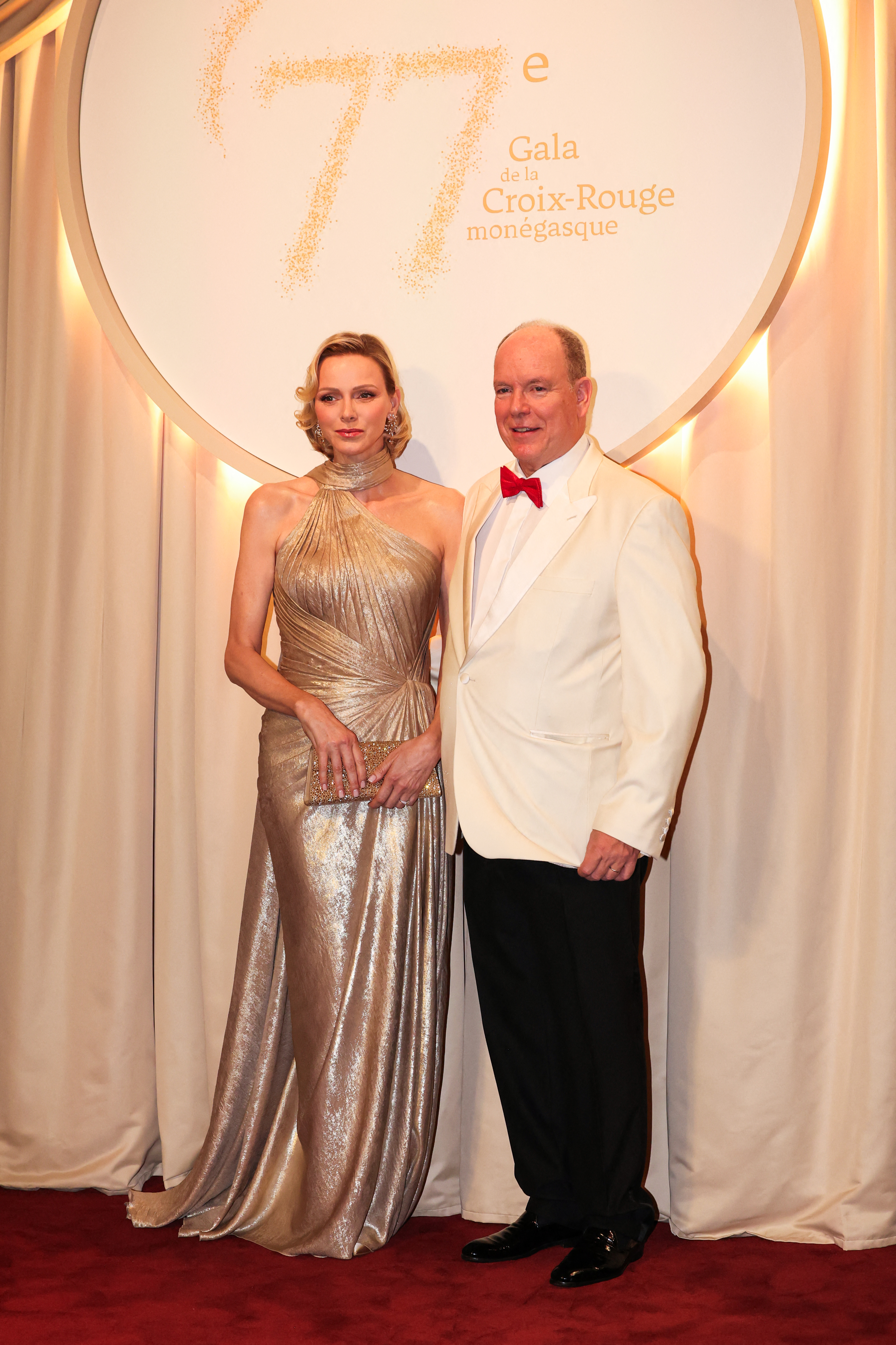 Princess Charlene wears a custom shimmering gold gown from Elie Saab, channeling her late mother-in-law Grace Kelly
