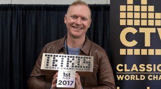 Jonas Neubauer holds his trophy from the 2017 Classic Tetris World Championship