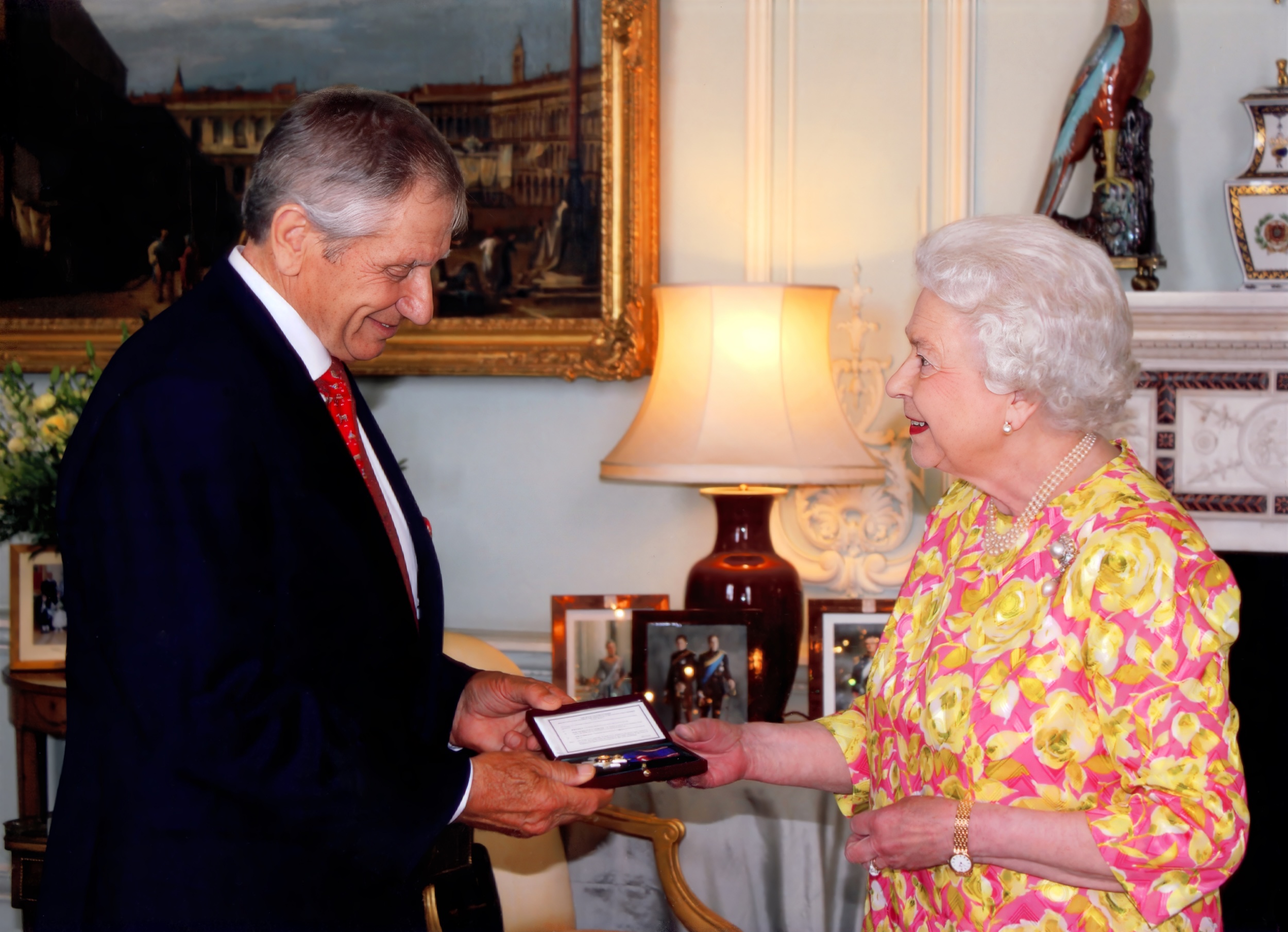 Monty Roberts receiving an MVO from Queen Elizabeth