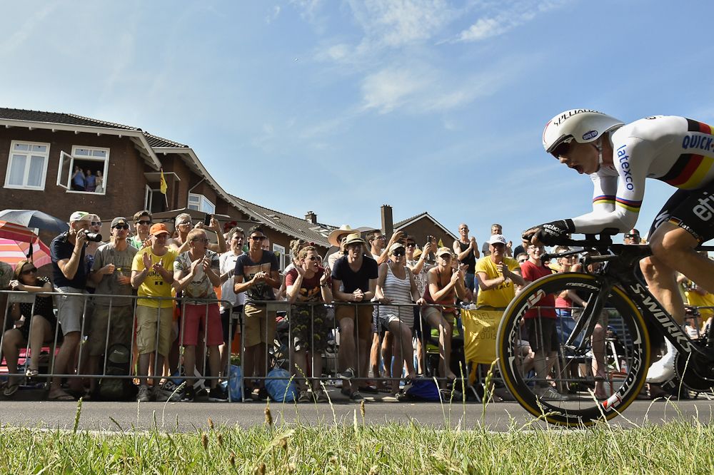 Tony Martin passes screaming spectators.