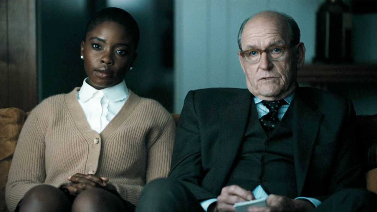 Joy Sunday on the left, Richard Jenkins on the right, both looking towards the camera in DTF St. Louis. 