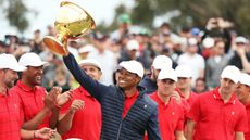Team United States captain Tiger Woods lifts the Presidents Cup