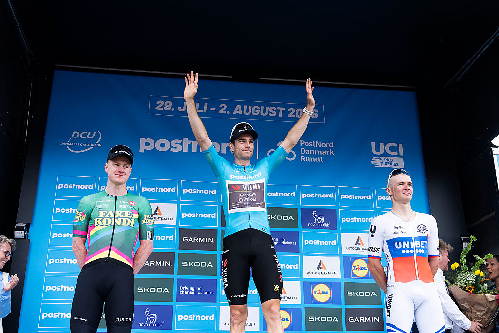 Overall winner Wout Van Aert celebrates on the podium next to second placed Lukas Kubis and third placed Henrik Breiner Pedersen at the Tour of Denmark 2026