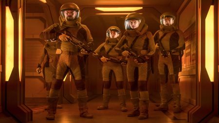 a group of armed space explorers in a hallway