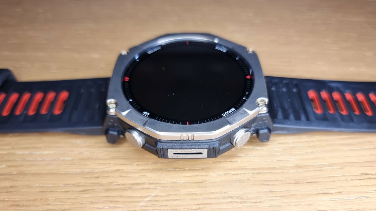 a close-up picture of the Amazfit T-Rex Ultra 2 smartwatch laid flat on a table