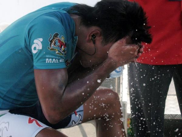 Asian rider classification leader Anuar Manan cools down after another hot day