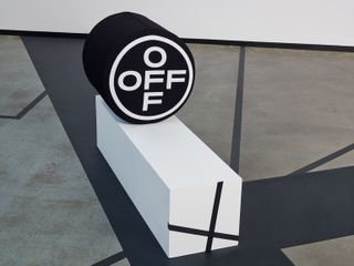 Off-White’s interiors line logo on a white platform