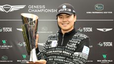Junghwan Lee with the Genesis Championship trophy 