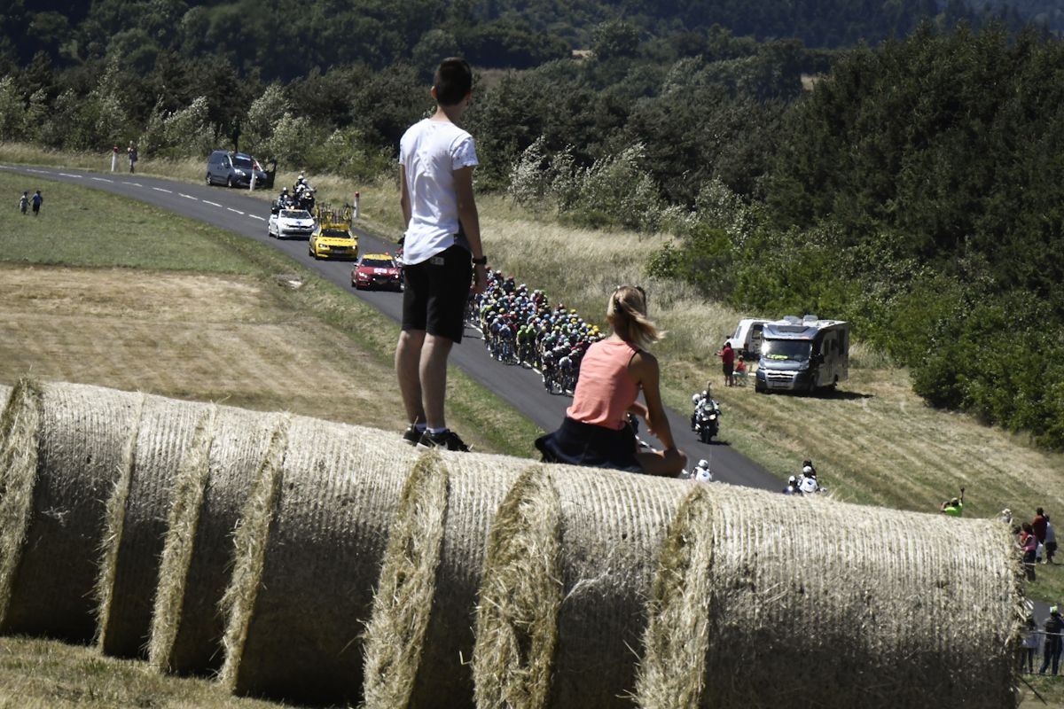 Spectators watch the peloton pass by during stage 16 at the Tour de France