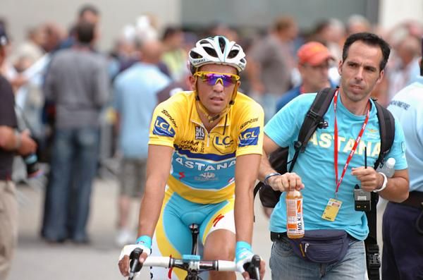 Alberto Contador (Astana) gets a post-race drink from his soigneur.