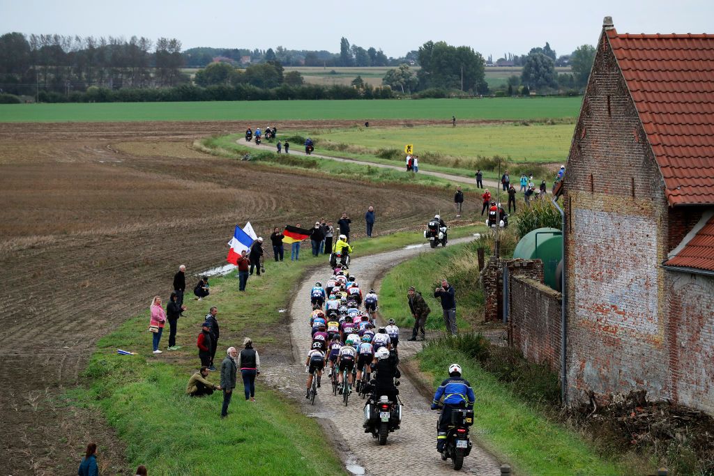 ROUBAIX FRANCE OCTOBER 02 A general view of Ellen Van Dijk of Netherlands and Team Trek Segafredo Audrey CordonRagot of France and Team Trek Segafredo Elisa Longo Borghini of Italy and Team Trek Segafredo Marianne Vos of Netherlands and Jumbo Visma Team Teuntje Beekhuis of Netherlands and Jumbo Visma Team Romy Kasper of Germany and Jumbo Visma Team Riejanne Markus of Netherlands and Jumbo Visma Team Chantal Van Den Broek Blaak of Netherlands and Team SD Worx Christine Majerus of Luxembourg and Team SD Worx Amy Pieters of Netherlands and Team SD Worx Aude Biannic of France and Movistar Team Emma Norsgaard Jorgensen of Denmark and Movistar Team Leah Thomas of United States and Movistar Team Lisa Brennauer of Germany and Ceratizit WNT Pro Cycling Team Franziska Koch of Germany and Team DSM Marta Cavalli of Italy and Team FDJ Nouvelle Aquitaine Futuroscope Marta Bastianelli of Italy and Team Ale Btc Ljubljana Sarah Roy of Australia and Team BikeExchange Maria Martins of Portugal and Team DropsLe Col Supported By Tempur and Marjolein Van T Geloof of Netherlands and Team DropsLe Col Supported By Tempur compete in the chase group passing through cobblestones sector during the 1st ParisRoubaix 2021 Womens Elite a 1164km race from Denain to Roubaix ParisRoubaixFemmes ParisRoubaix on October 02 2021 in Roubaix France Photo by Bas CzerwinskiGetty Images