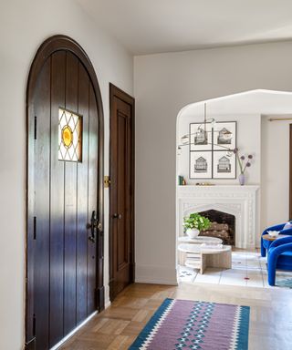 White entryways with dark wooden door