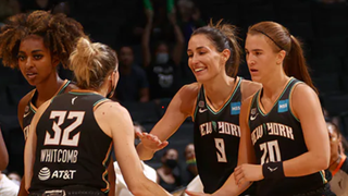New York Liberty players in action in WNBA game.