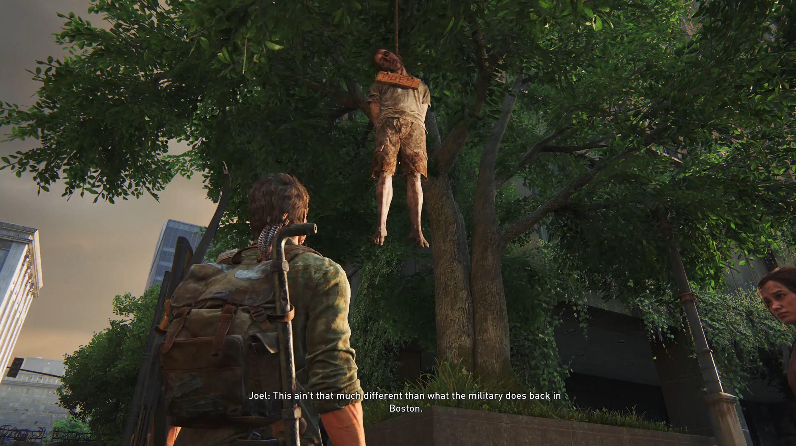 Joel looking at a hanging man in The Last of Us Part 1