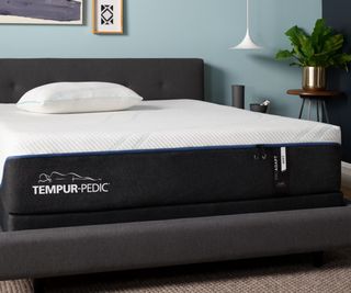 A Tempur-Pedic mattress in a bedroom.