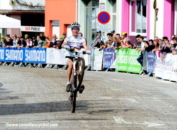 Victor Koretzky (Bikepark.ch Craft) showboats as he crosses the line to win