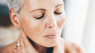 close-up of woman's face wearing blush on cheeks