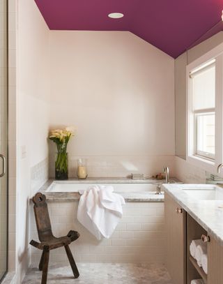 A small bathroom with painted ceiling