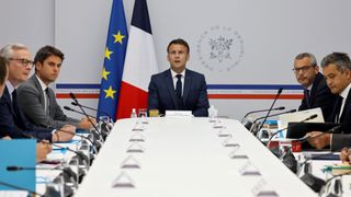 France's President Emmanuel Macron (C), flanked by France's Prime Minister Gabriel Attal (2nd L), France's Minister for Economy and Finances Bruno Le Maire (L), France's Minister for Interior and Overseas Gerald Darmanin (R), and Elysee's general secretary Alexis Kohler (2nd R), chairs a security and defence council at the Elysee presidential palace in Paris on May 16, 2024, after three nights of clashes in France's riot-struck Pacific territory of New Caledonia protest following a reform changing voting rolls that representatives of the indigenous Kanak population say will dilute their vote.