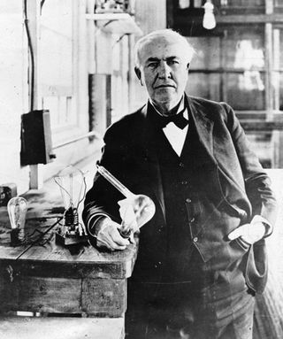 Thomas Edison with some of his incandescent bulbs.