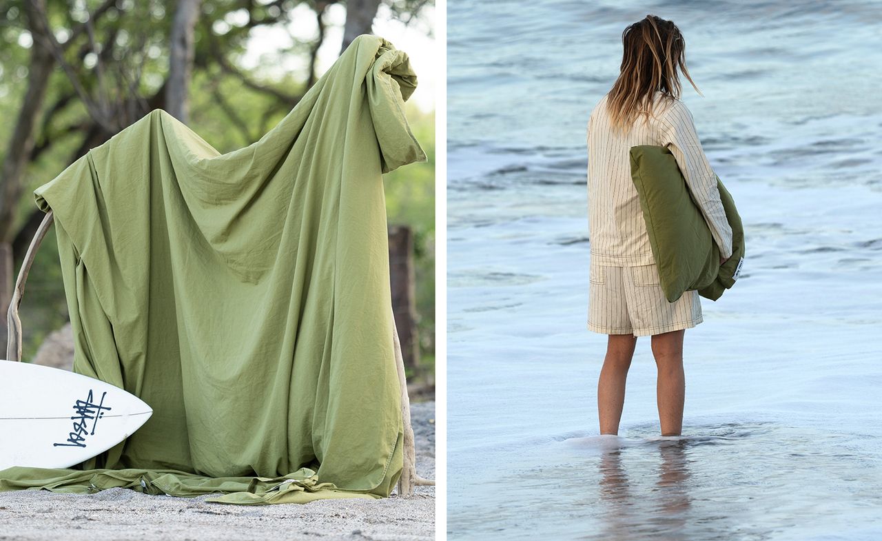 Pieces from the Tekla x Stussy collaboration on the beach and worn by a model standing in the water