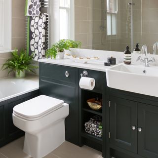 white toilet in black bathroom