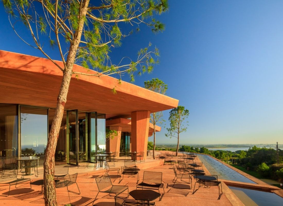 The clubhouse and outdoor seating area at Palmares Ocean Living and Golf