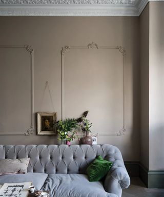 Living room with gray velvet sofa painted in Farrow & Ball Jitney