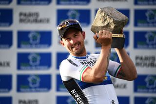 Sonny Colbrelli holds the trophy of Paris-Roubaix winner