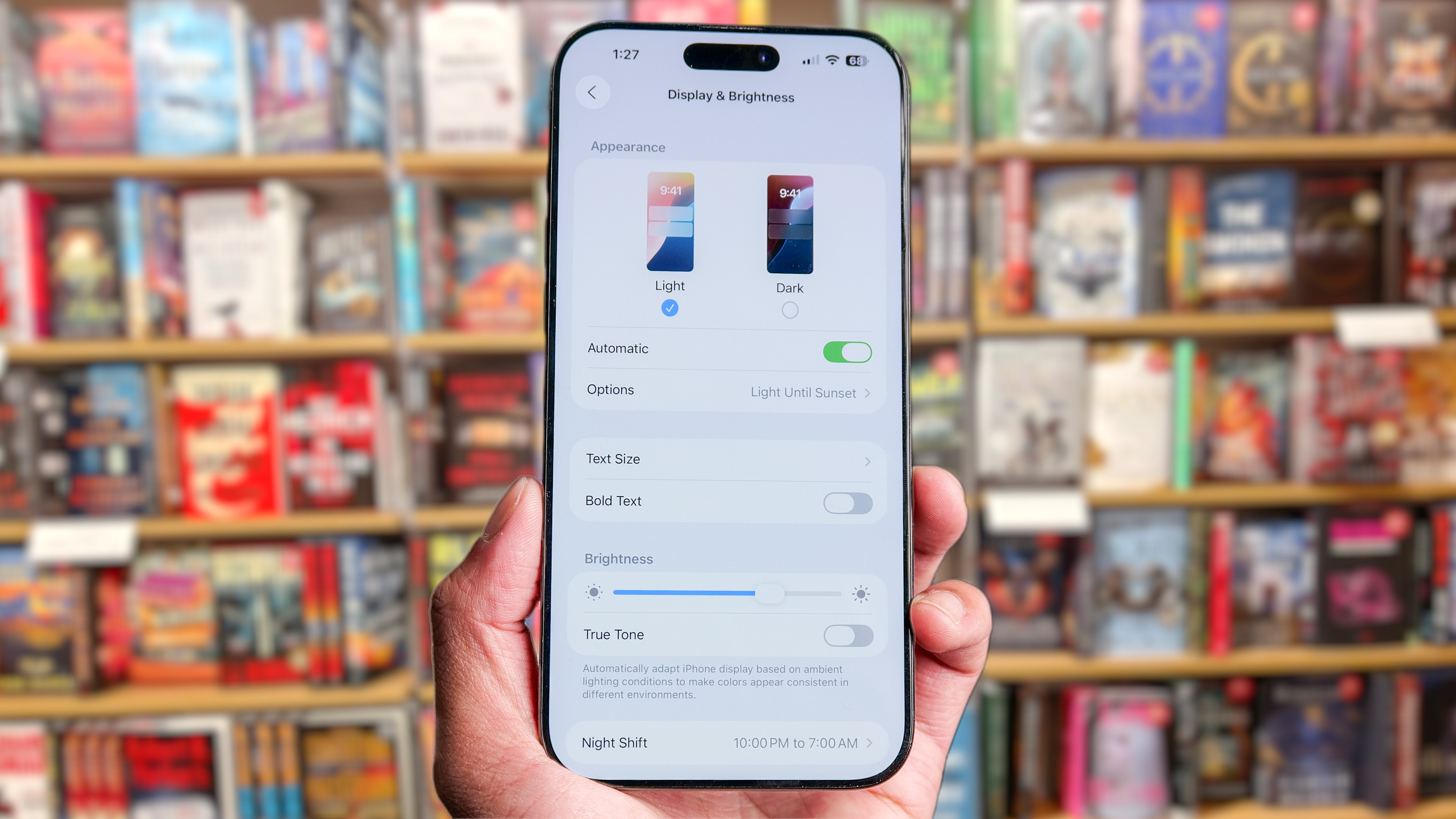 iPhone showing Auto-Brightness setting.