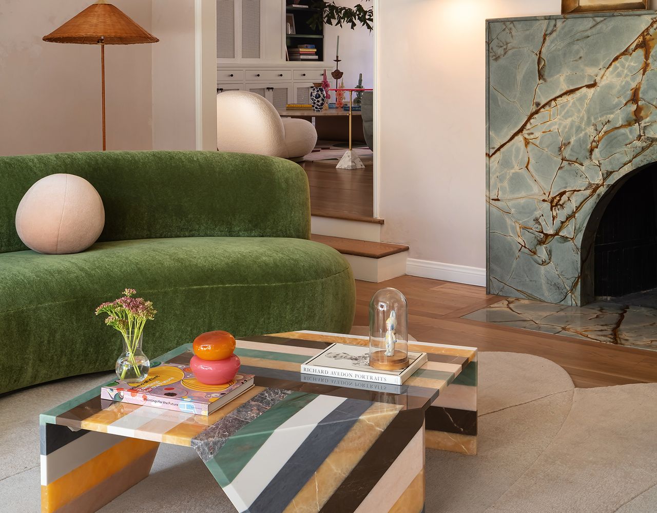 living room with green sofa and stripy coffee table