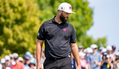 Jon Rahm walks up to a putt