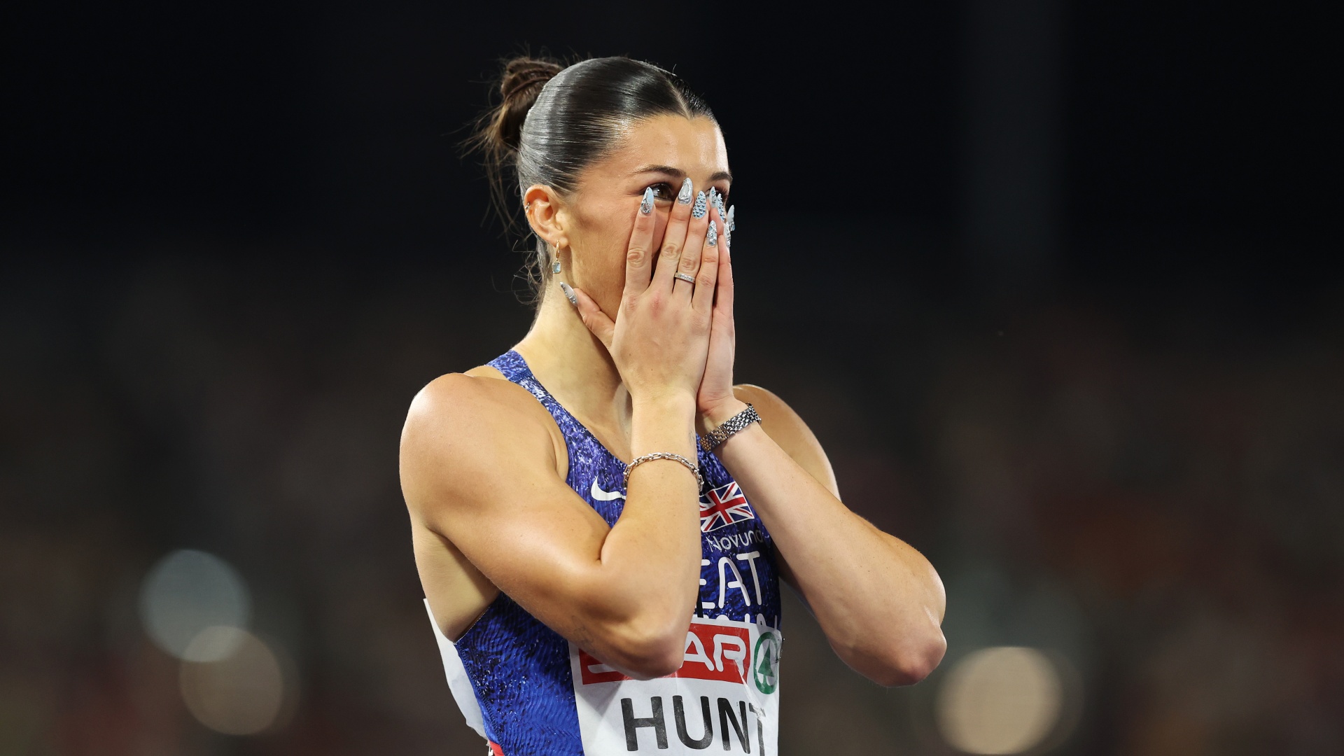 Amy Hunt celebrates winning the 100m at European Athletics Championships 2026