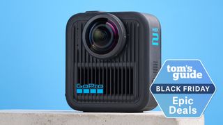 A GoPro MAX2 on a stone surface against a blue background with a Tom's Guide Black Friday deal badge in the bottom right corner of the image.