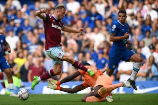 Jarrod Bowen of West Ham United fouls Edouard Mendy of Chelsea leading to a VAR decision to disallow West Ham's 2nd goal during the Premier League match between Chelsea FC and West Ham United at Stamford Bridge on September 03, 2022 in London, England. (Photo by Mike Hewitt/Getty Images)