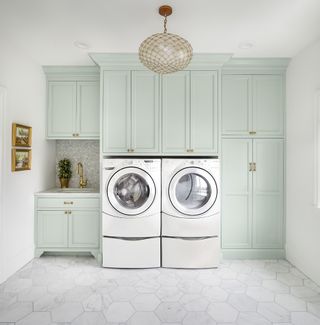 The Fox group mint green laundry room cabinetry