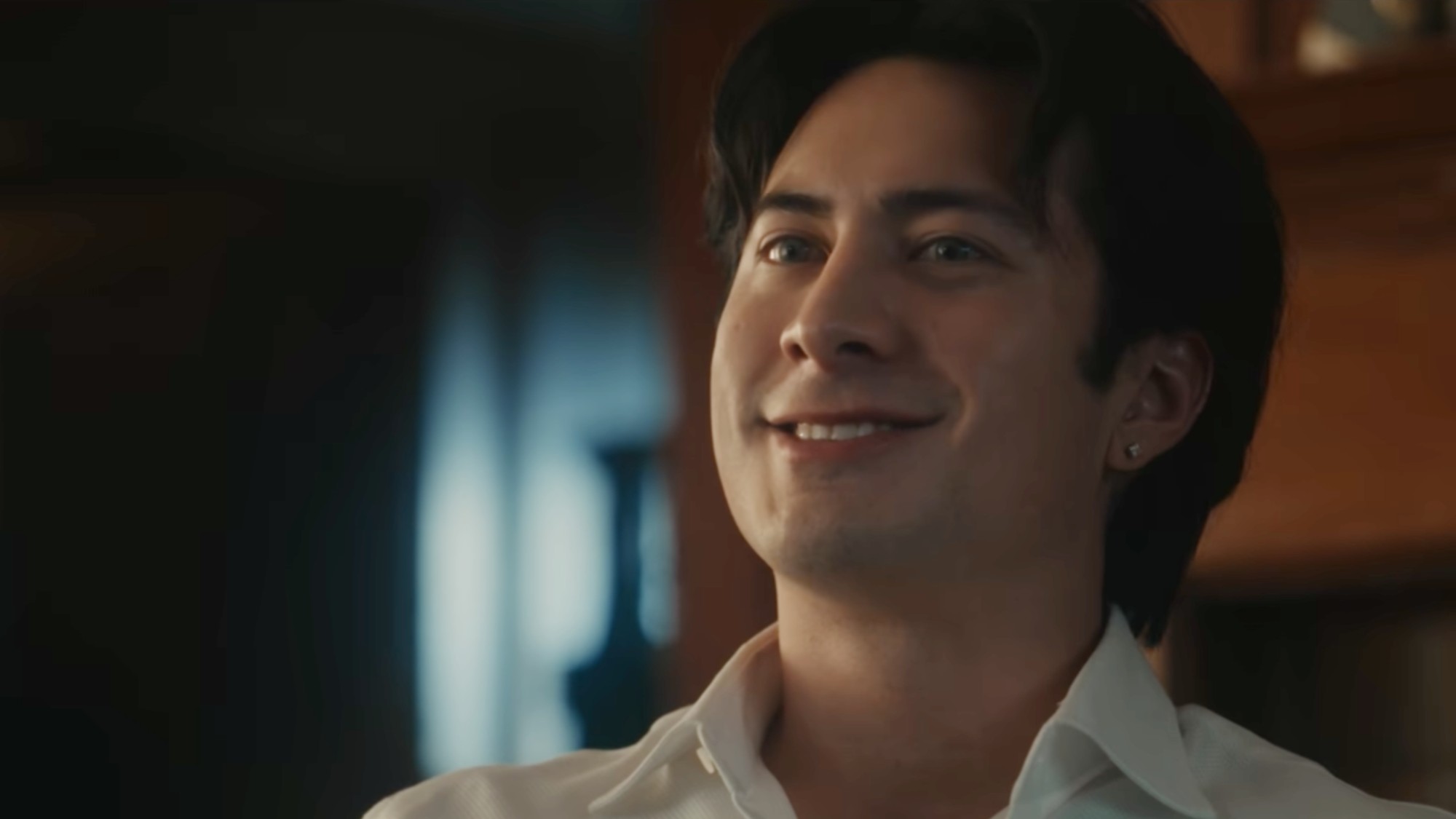 Hudson Williams smiling in Yaga.