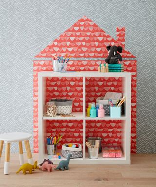 girls bedroom with craft storage house with toys
