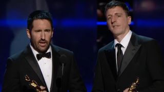 Trent Reznor and Atticus Ross accept their awards for The Social Network at the 83rd Academy Awards.